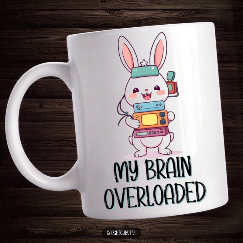 Funny mug with a cheerful rabbit character precariously balancing a tall stack of diverse small electronic gadgets.