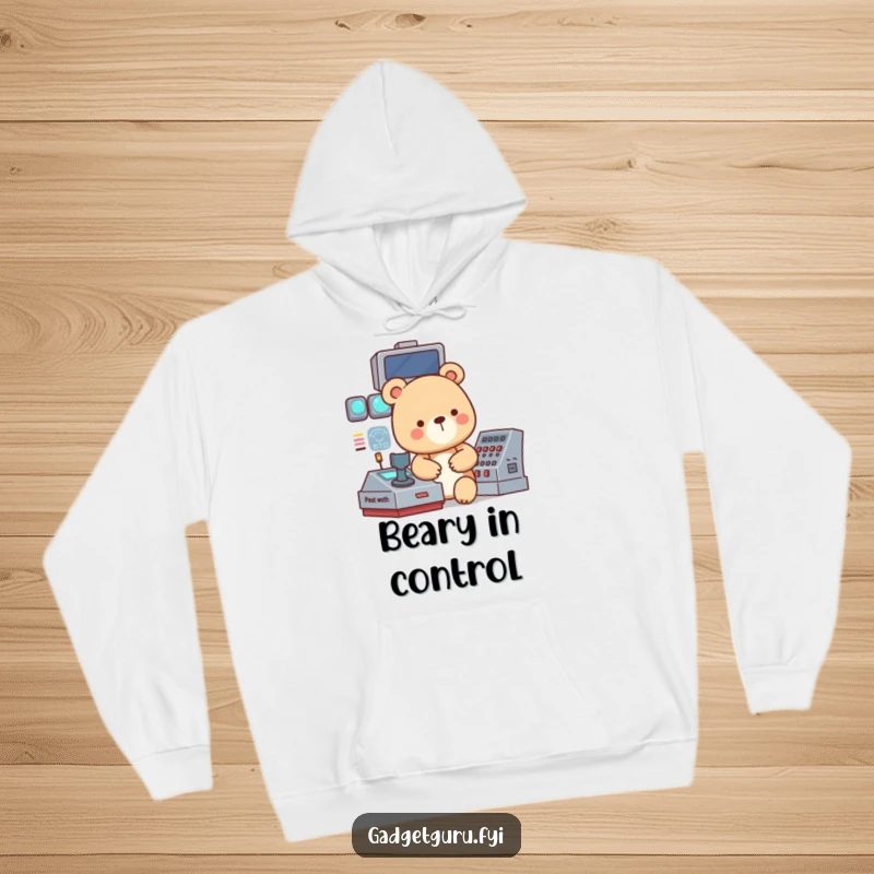 Funny hoodie with a small, focused bear character operating a complex, blinking control panel, projecting intense concentration.