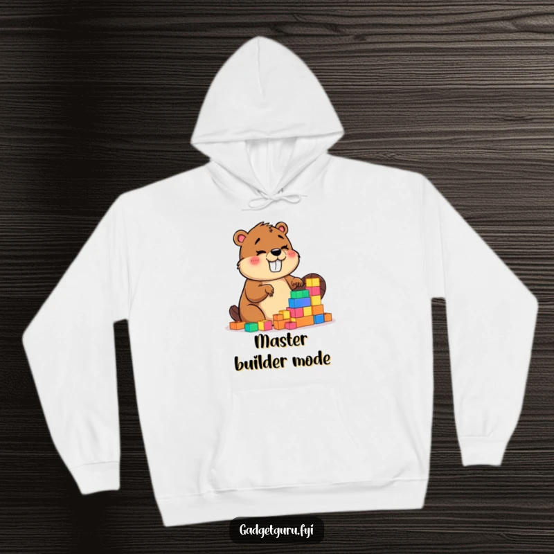 Funny hoodie depicting a gleeful beaver character focused on building with small, luminous blocks, showcasing intense concentration and delight.