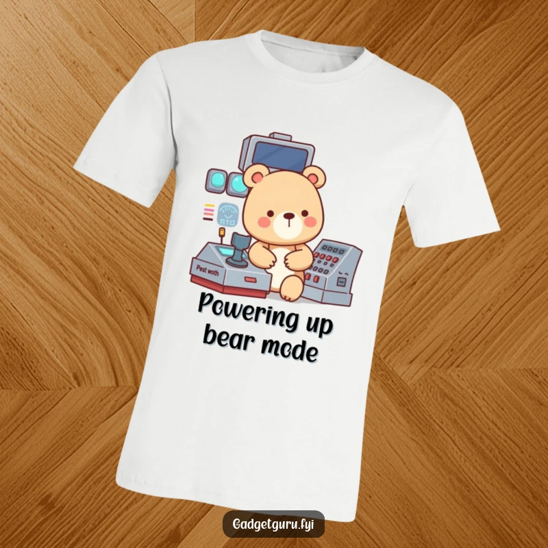 Funny T-shirt featuring a small, focused bear character intently working a complex, blinking control panel with serious concentration.